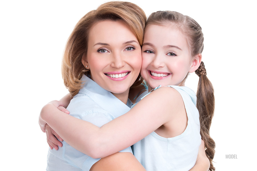 Mother and daughter hugging each other